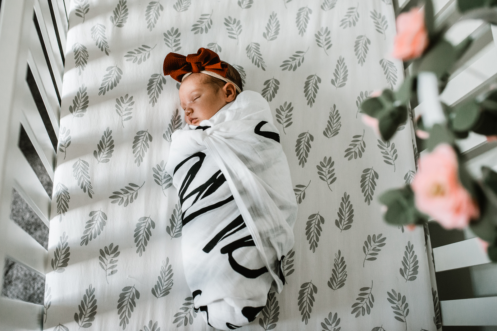 Omaha family cuddling with their newborn during their in-home newborn session with Melissa Lindquist Photography.