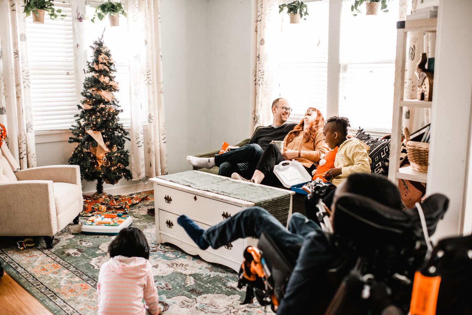 Family laughing and having fun during storytelling photo session with Melissa Lindquist Photography.