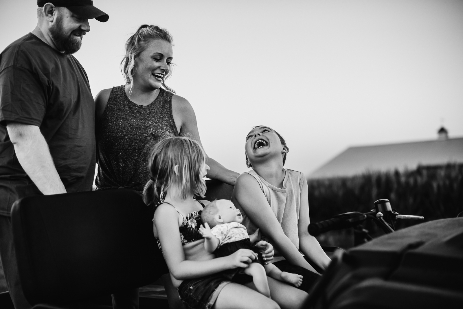 Family laughing and having fun during storytelling photo session with Melissa Lindquist Photography.