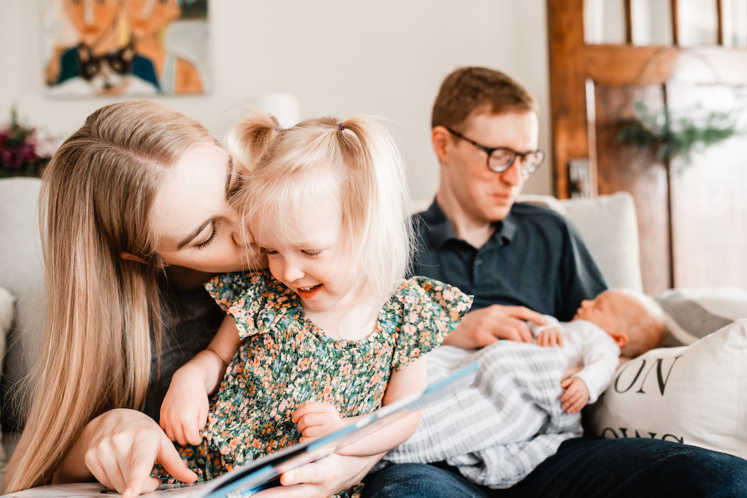 Joyful family moments captured during an in-home family session in Omaha