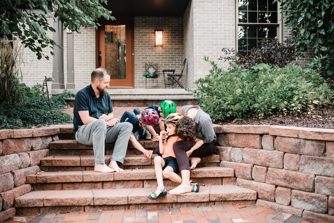 Family enjoying a relaxed in-home family photography session in Omaha, Nebraska