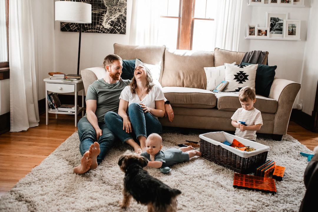 Family enjoying a relaxed in-home family photography session in Omaha, Nebraska