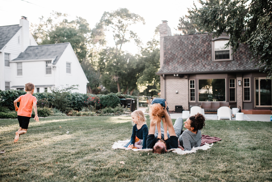 Family connecting at home during a cozy in-home photography session in Omaha, Nebraska