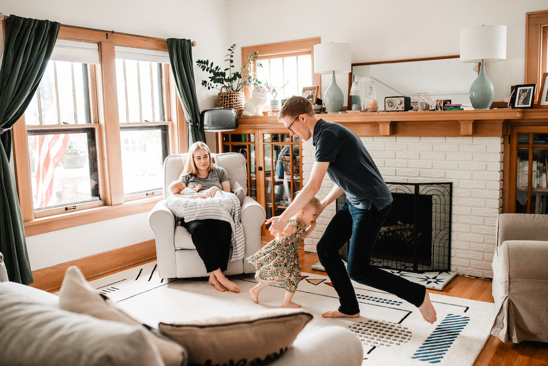 Family enjoying a relaxed in-home family photography session in Omaha, Nebraska
