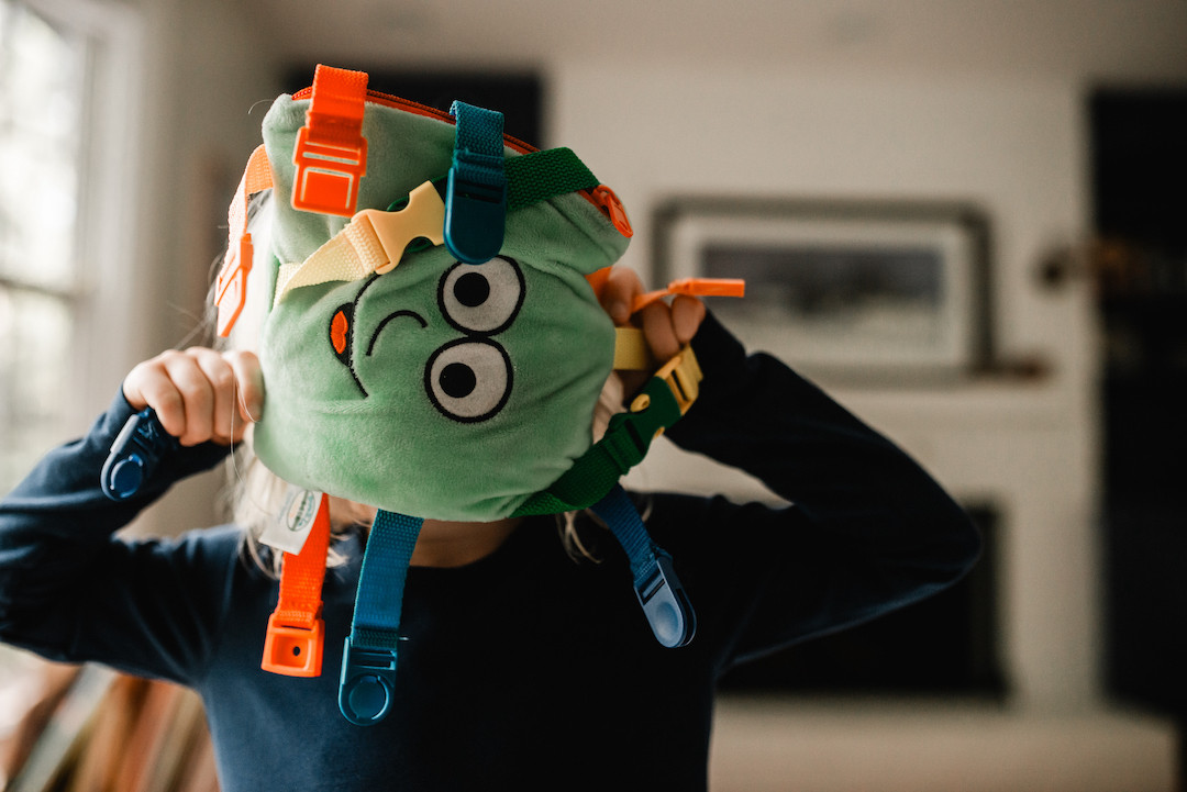 Candid family moments during an in-home family photography session in Omaha