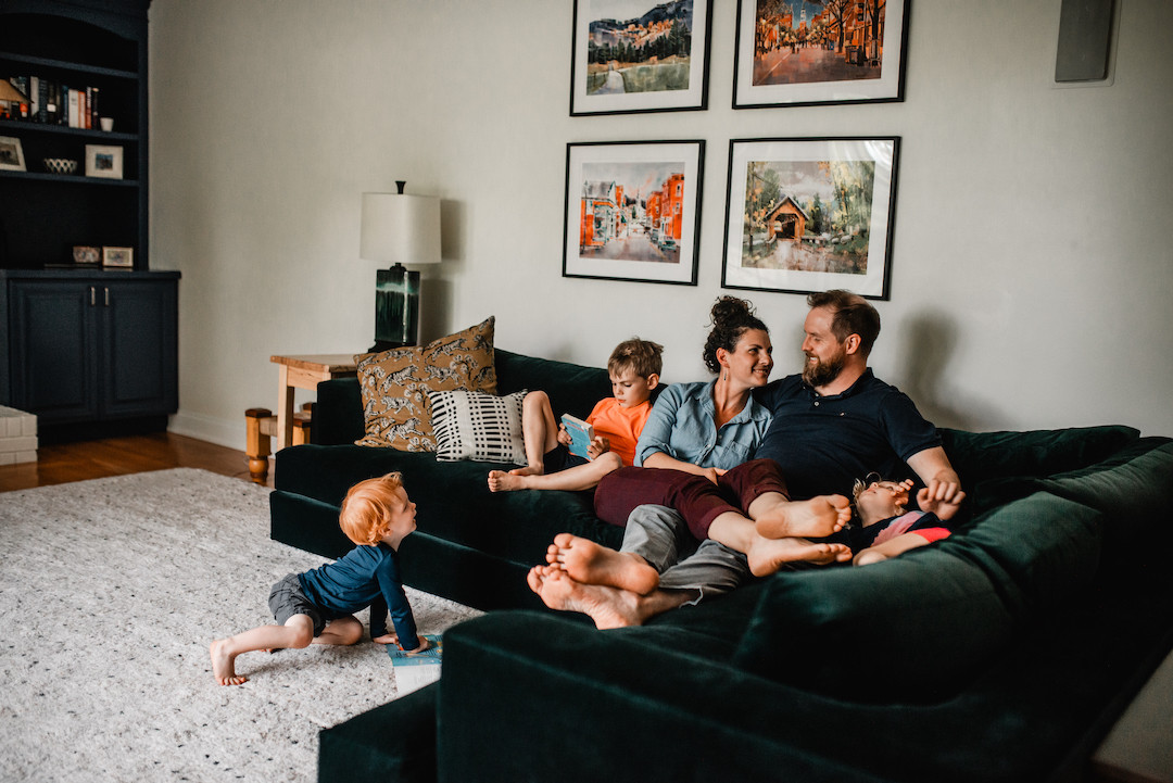 Family connecting at home during a cozy in-home photography session in Omaha, Nebraska