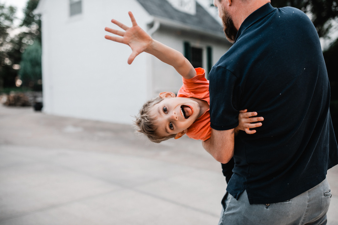 Family spending time together during an in-home family photography session in Omaha, NE