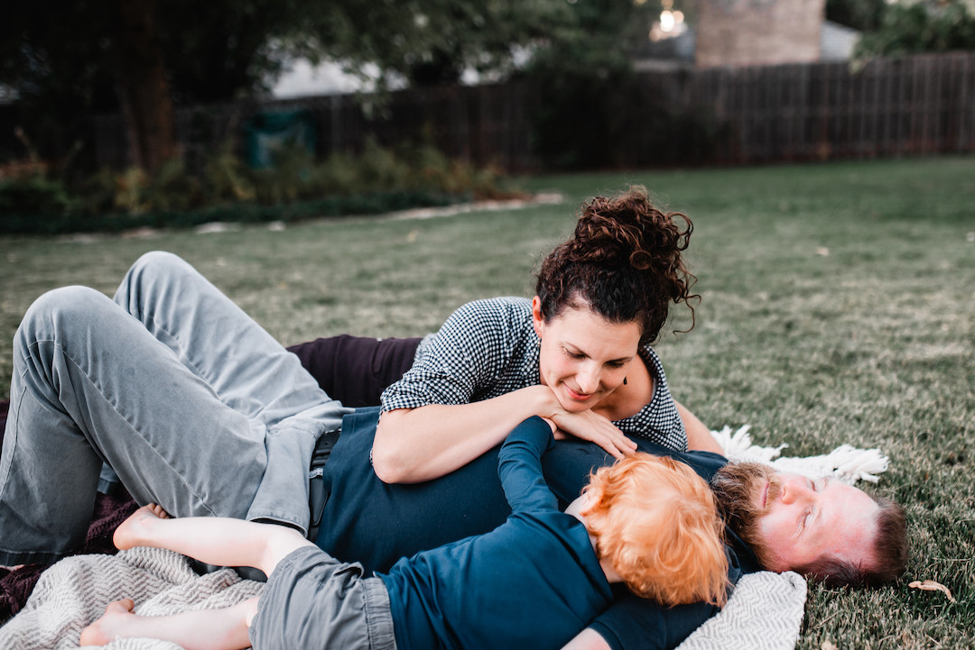 Family spending time together during an in-home family photography session in Omaha, NE