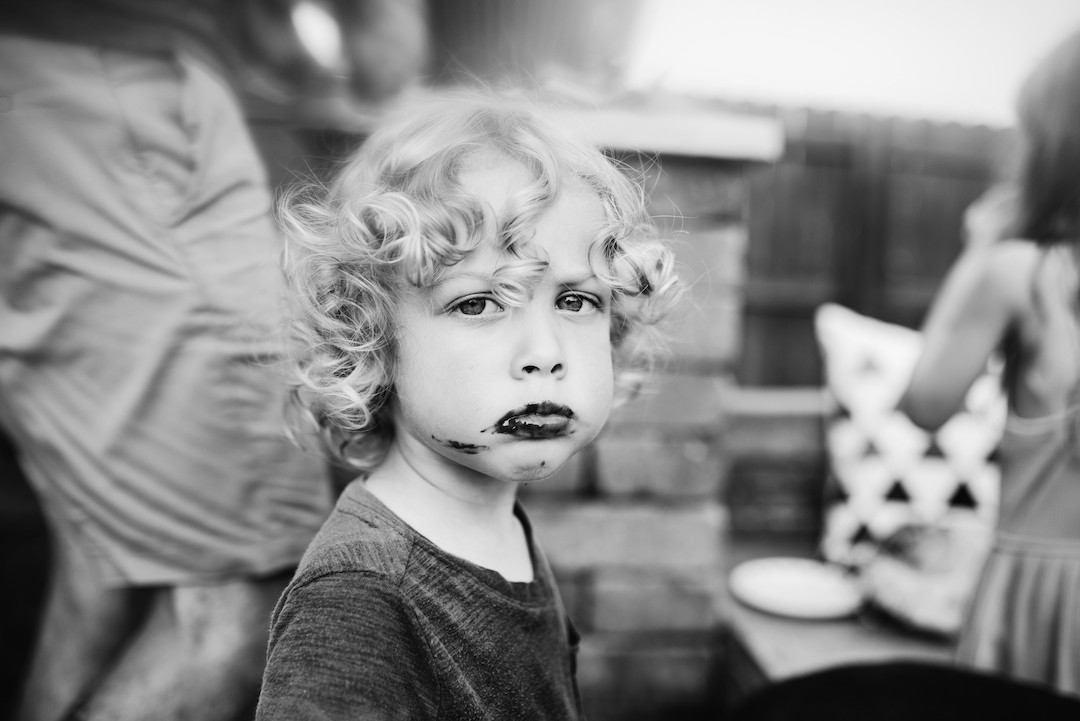 Family spending time together during an in-home family photography session in Omaha, NE