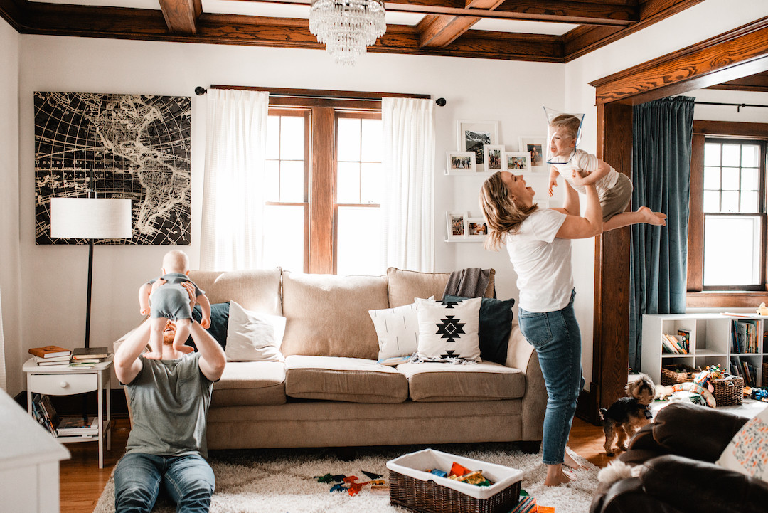 Family spending time together during an in-home family photography session in Omaha, NE