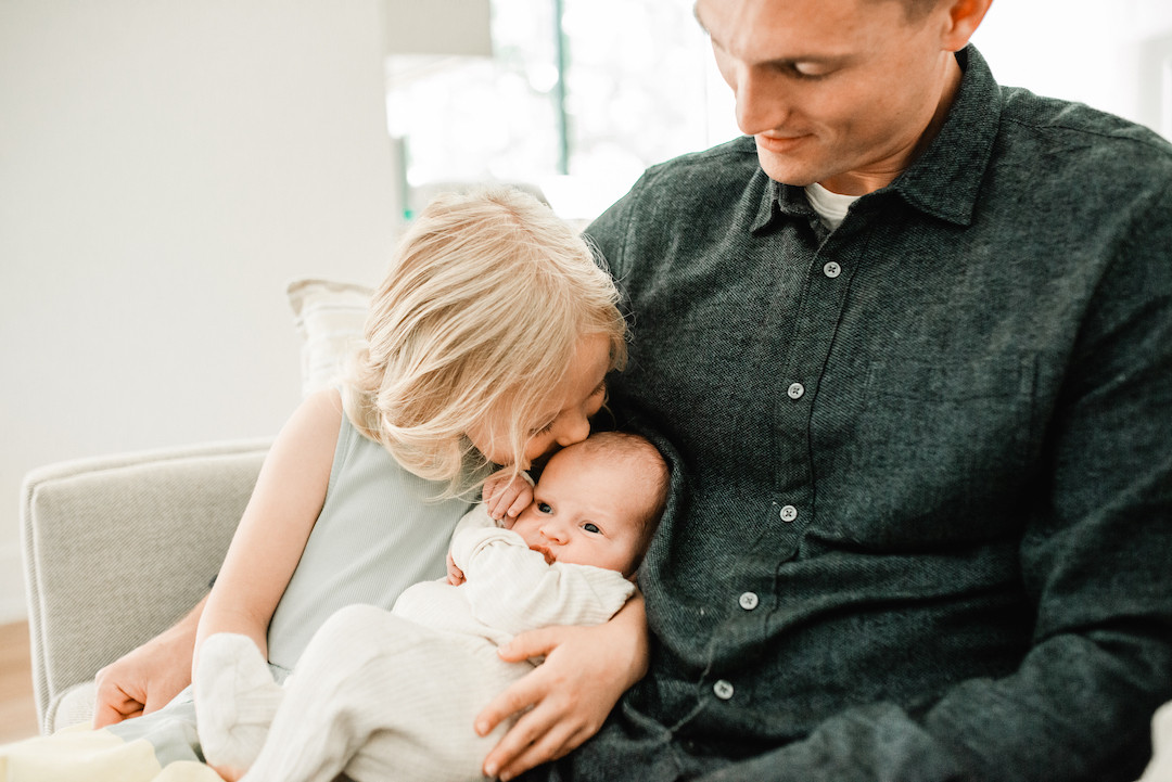 Authentic lifestyle newborn photography session inside an Omaha home