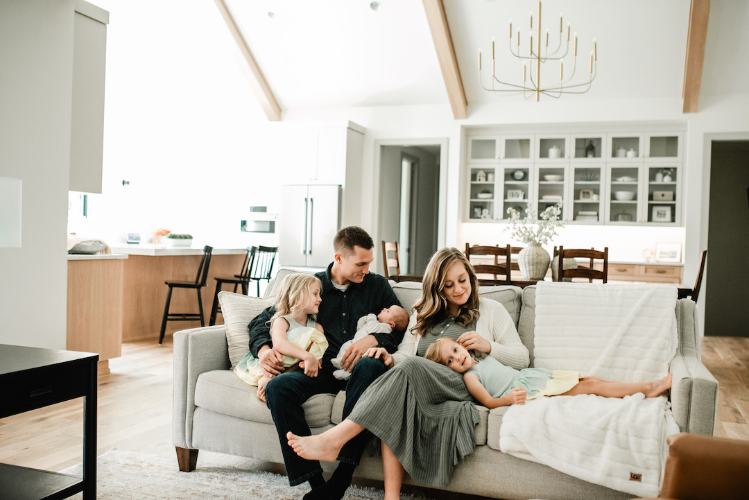 Soft and natural in-home newborn photography capturing real family moments in Omaha