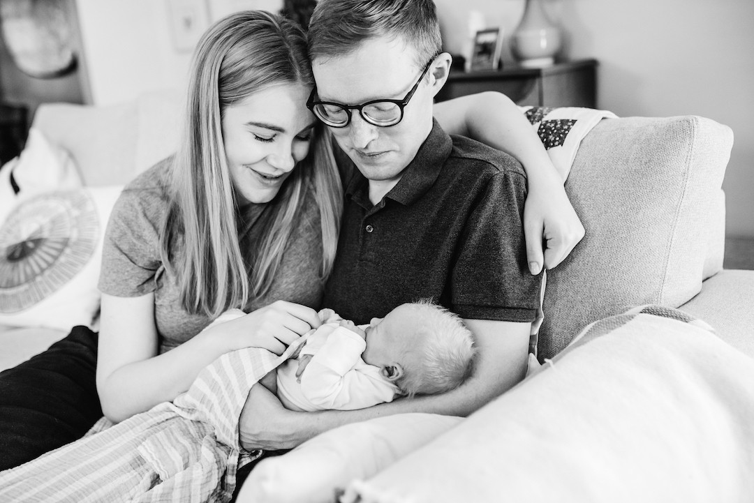 Soft and natural in-home newborn photography capturing real family moments in Omaha