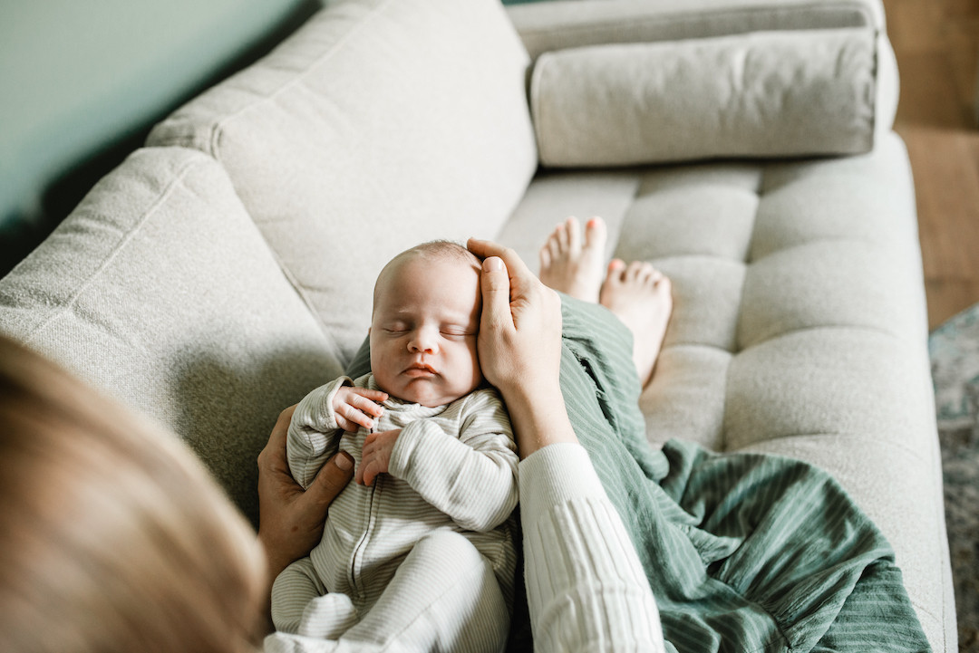 Relaxed lifestyle newborn photography session at home in Omaha, Nebraska