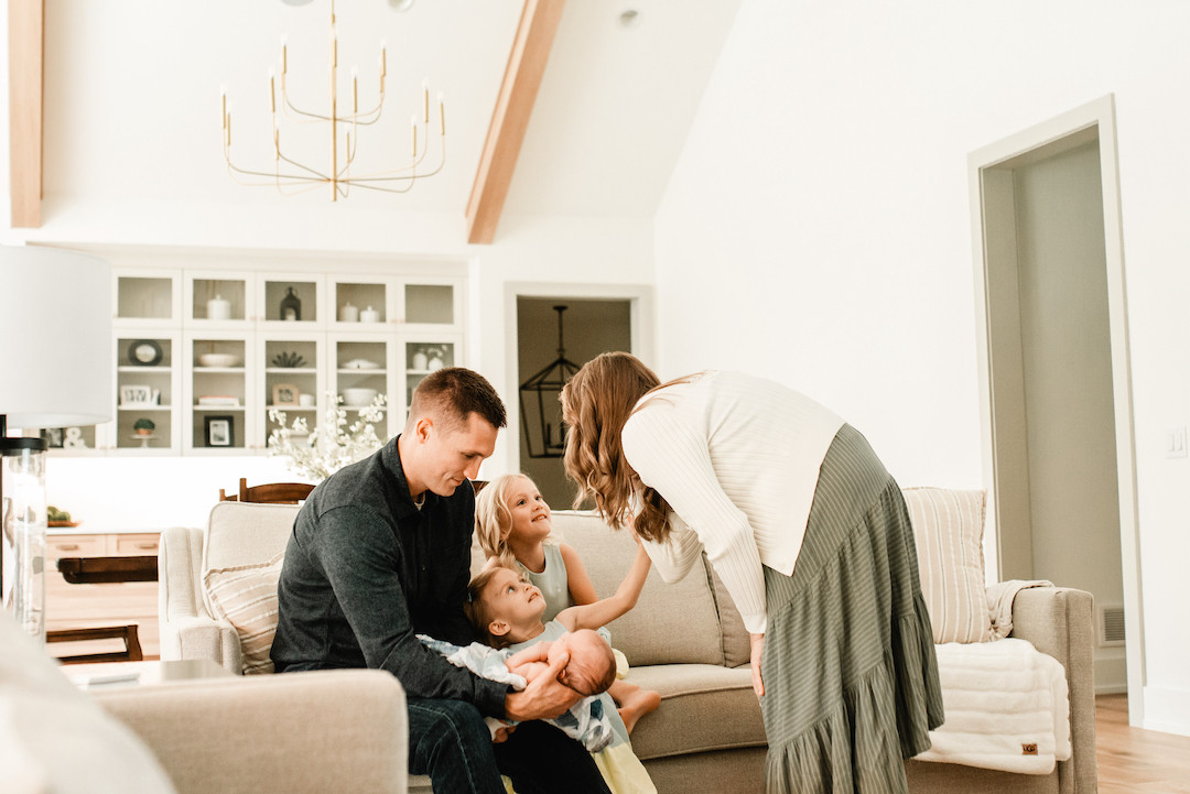 Candid in-home newborn photography documenting early days with a baby in Omaha