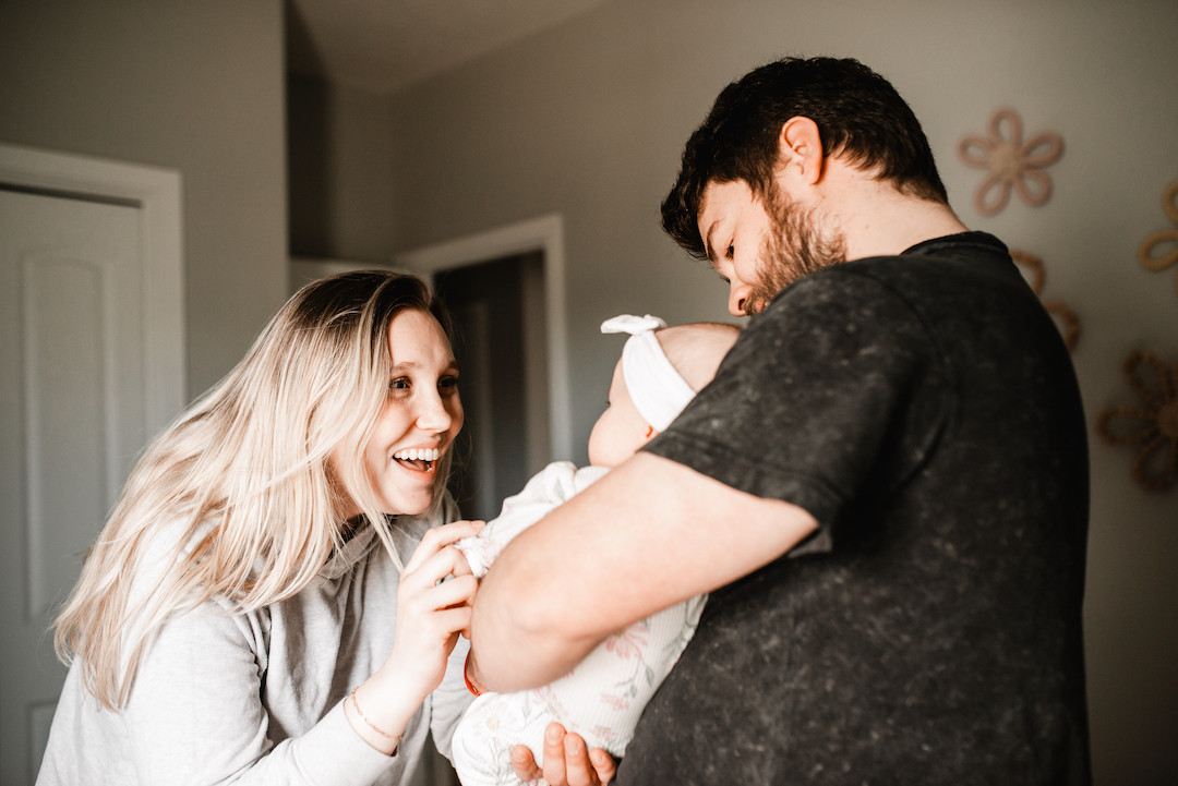 Authentic lifestyle newborn photography session inside an Omaha home